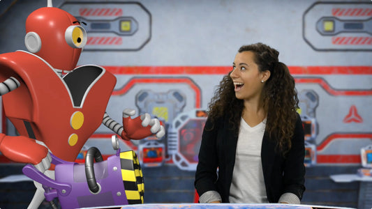 A screencap from one of the Bible intro videos showing an actress and an evil robot
