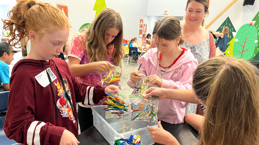 Woman leading a Bible science experiment with girls to illustrate eternal life