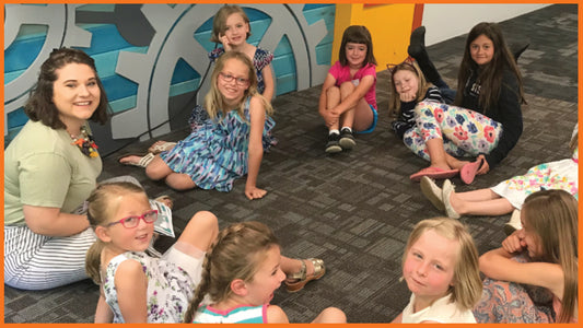 Young woman leading Spyence small group discussion in children’s ministry